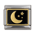 A gold-tone crescent moon and tiny stars on a black enamel tile.