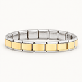 Gold-centre Italian charm bracelet with silver-tone edges on a warm white background